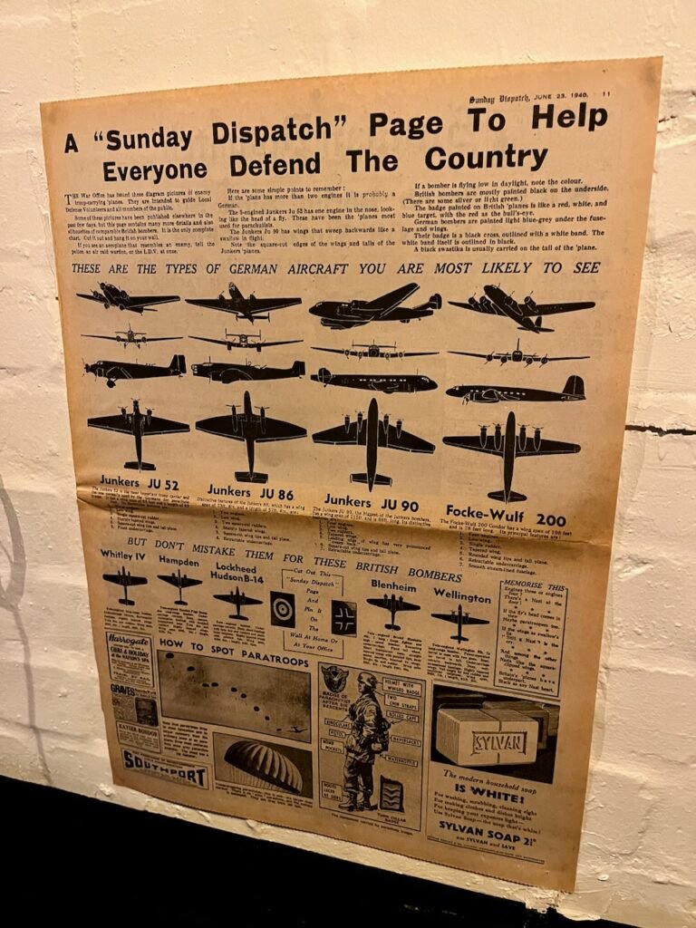 Vintage WWII-era newspaper page titled "A 'Sunday Dispatch' Page To Help Everyone Defend The Country" with silhouettes of German and British aircraft for identification, dated June 23, 1940.