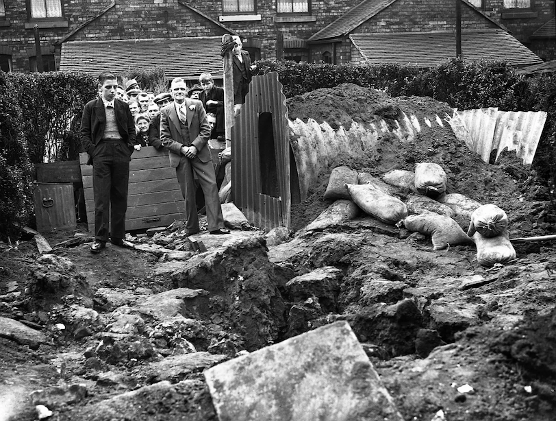  Stoke-on-Trent September 1940. A man, his wife and their nine children were in an Anderson shelter and escaped injury when their home was wrecked by a bomb.